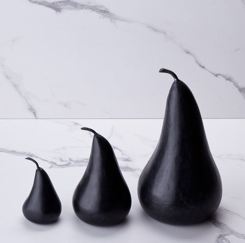 Small medium and large black marble pears