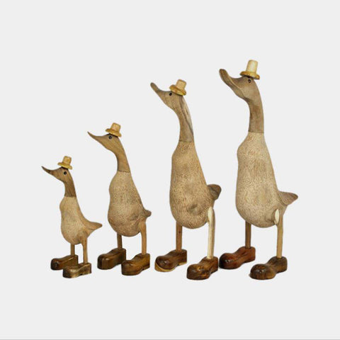 Family of ducks hand carved in bamboo wood with hat and boots